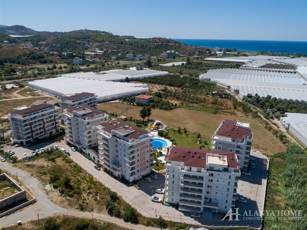 Фото купить продать недорогую квартиру недвижимость в доме жилом комплексе с видом на море Алания Хо